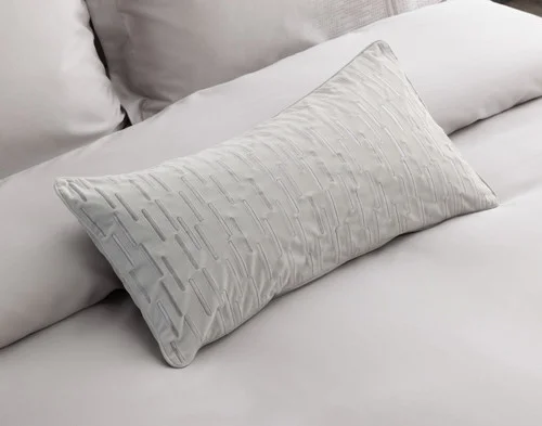 Our Renley Boudoir Pillow Cover decorating the head of a bed with our Renley collection.