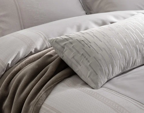 Our Renley Boudoir Pillow Cover dressing a bed with our Renley collection.