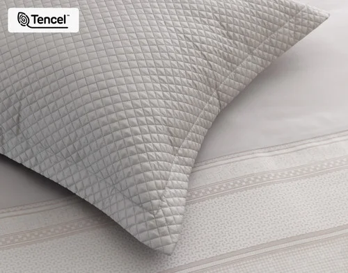The corner of our Renley Euro Sham atop our Renley Duvet Cover.