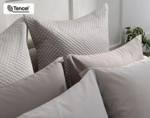 Our Renley Euro Shams decorating the head of a bed with other accessories.