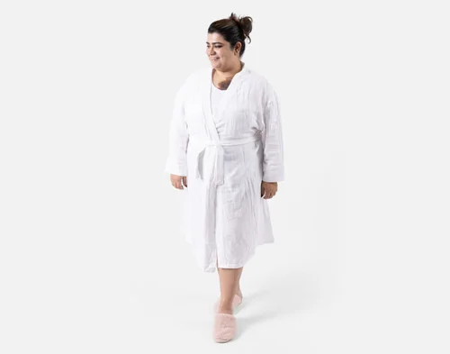 Front view of a woman wearing our Bamboo Cotton Gauze Bathrobe in White.