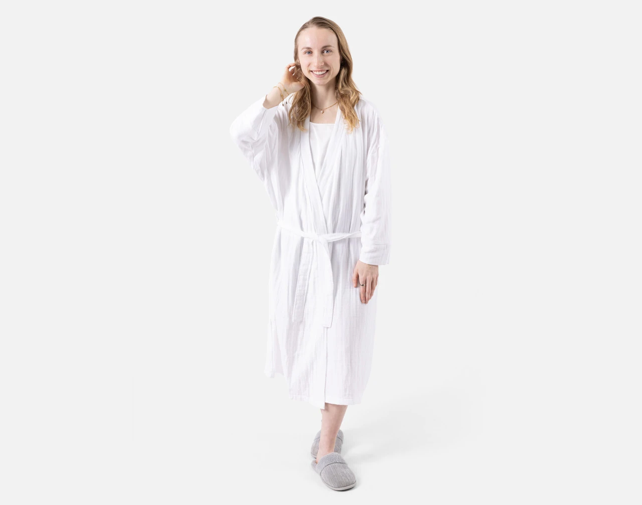 Front view of a woman wearing our Bamboo Cotton Gauze Bathrobe in White.
