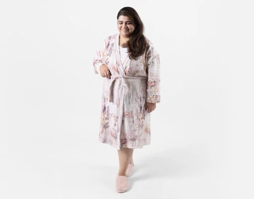 Front view of a woman wearing our Bamboo Cotton Gauze Bathrobe in Peach Blossom.