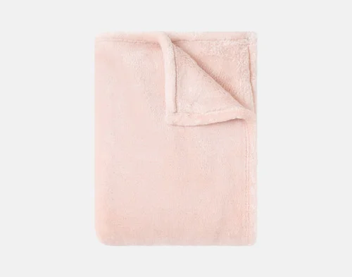 Our Velvet Plush Throw in Rosewater folded neatly into a tidy square.