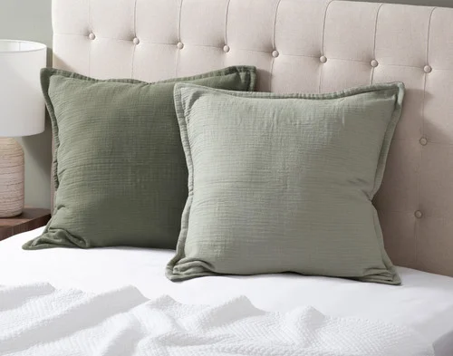 Our Bamboo Gauze Euro Shams in Leaf at the head of a bed.