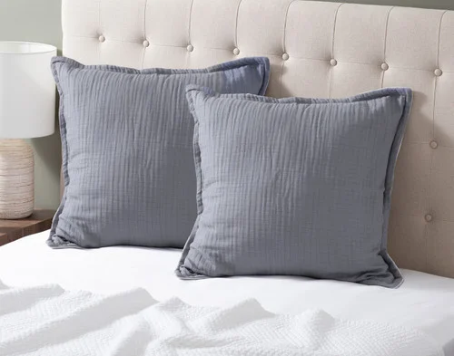 Our Bamboo Gauze Euro Shams in Seaside at the head of a bed.