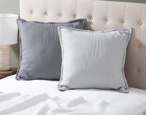 Our Bamboo Gauze Euro Shams in Seaside at the head of a bed.