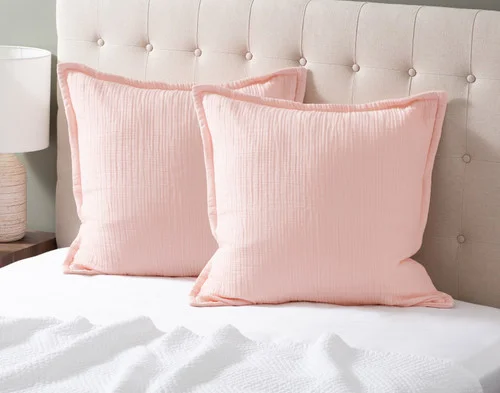 Two of our Bamboo Gauze Euro Shams in Blossom at the head of a bed.