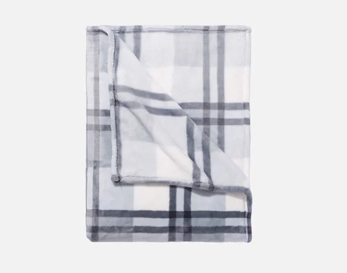 Our Coastline Plaid Blanket folded neatly into a square.