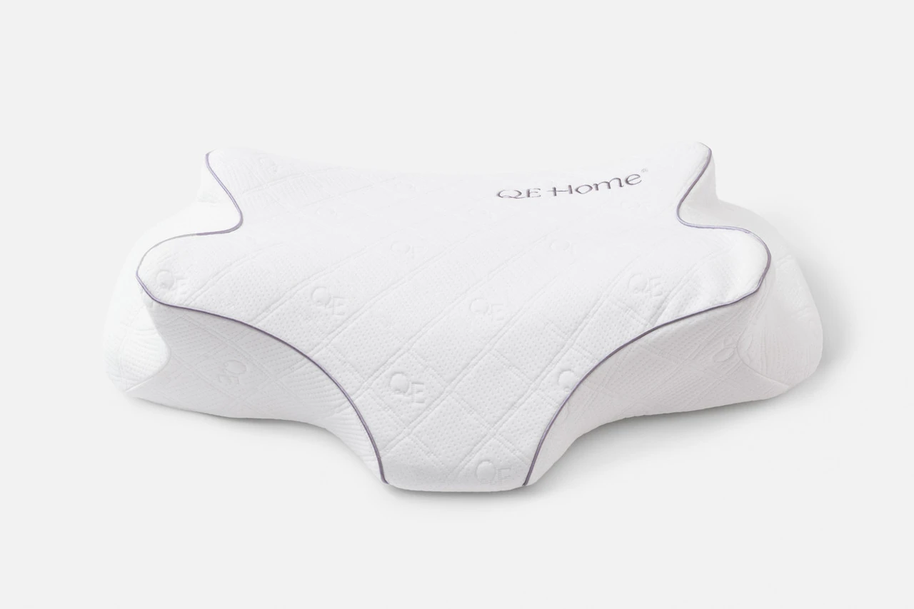 Front view of our Butterfly Memory Foam Pillow resting on a solid white ground.