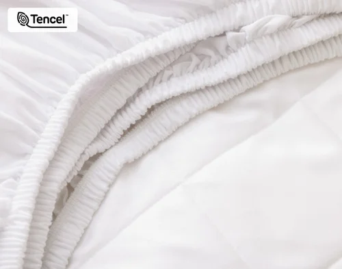 Close-up of the elastic edge and cotton blend skirt on our Ambience TENCEL™ Mattress Protector.
