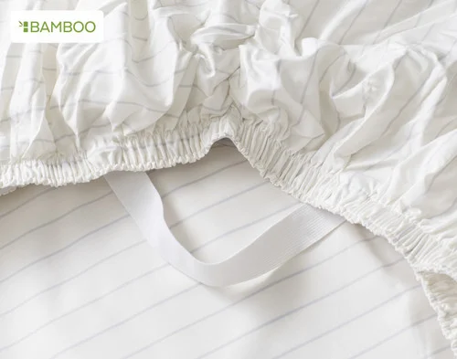 Close-up of the corner STAY SNUG elastics on our Bamboo Cotton Fitted Sheet in Ocean Stripe.