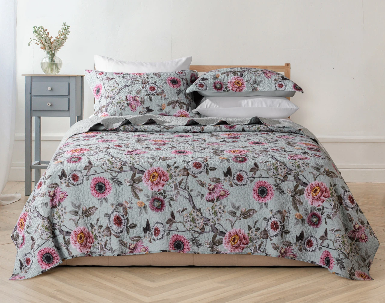 Front view of our Eloise Cotton Quilt Set dressing a queen bed in a modern bedroom.