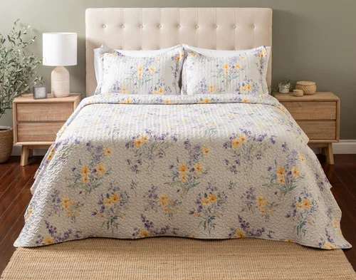 Front view of our Clara Coverlet Set dressed over a plain queen bed.