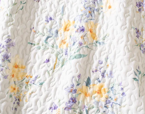 Close-up of the floral design on our Clara Coverlet Set.
