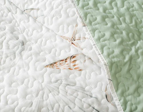 Close-up on a folded edge on our Shoreline Coverlet Set.