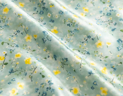 Close-up of the floral design and silk surface of our Mulberry Silk Pillowcase in Cadence.