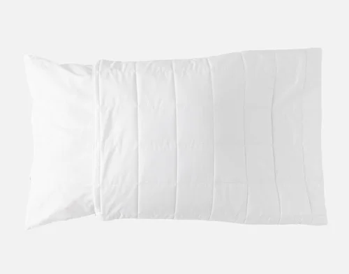 Our PureRest Wool Filled Pillow Protector halfway over a pillow.