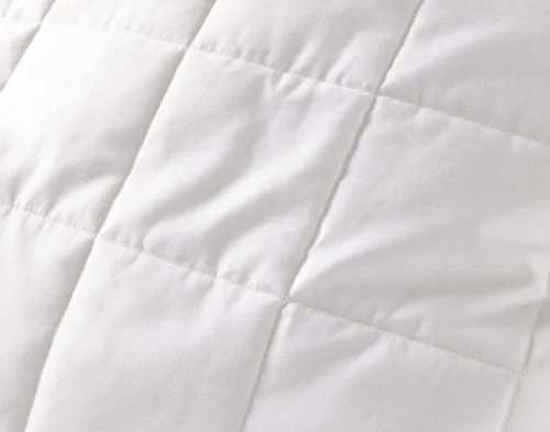 Close-up on the quilted surface of our PureRest Wool Filled Pillow Protector.