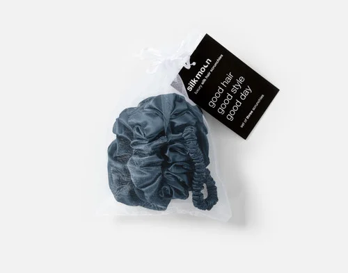 Top view of the mesh bag packaging holding our Blue Mulberry Silk Scrunchie Set.