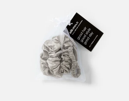 Top view of the mesh bag packaging holding our Latte Mulberry Silk Scrunchie Set.