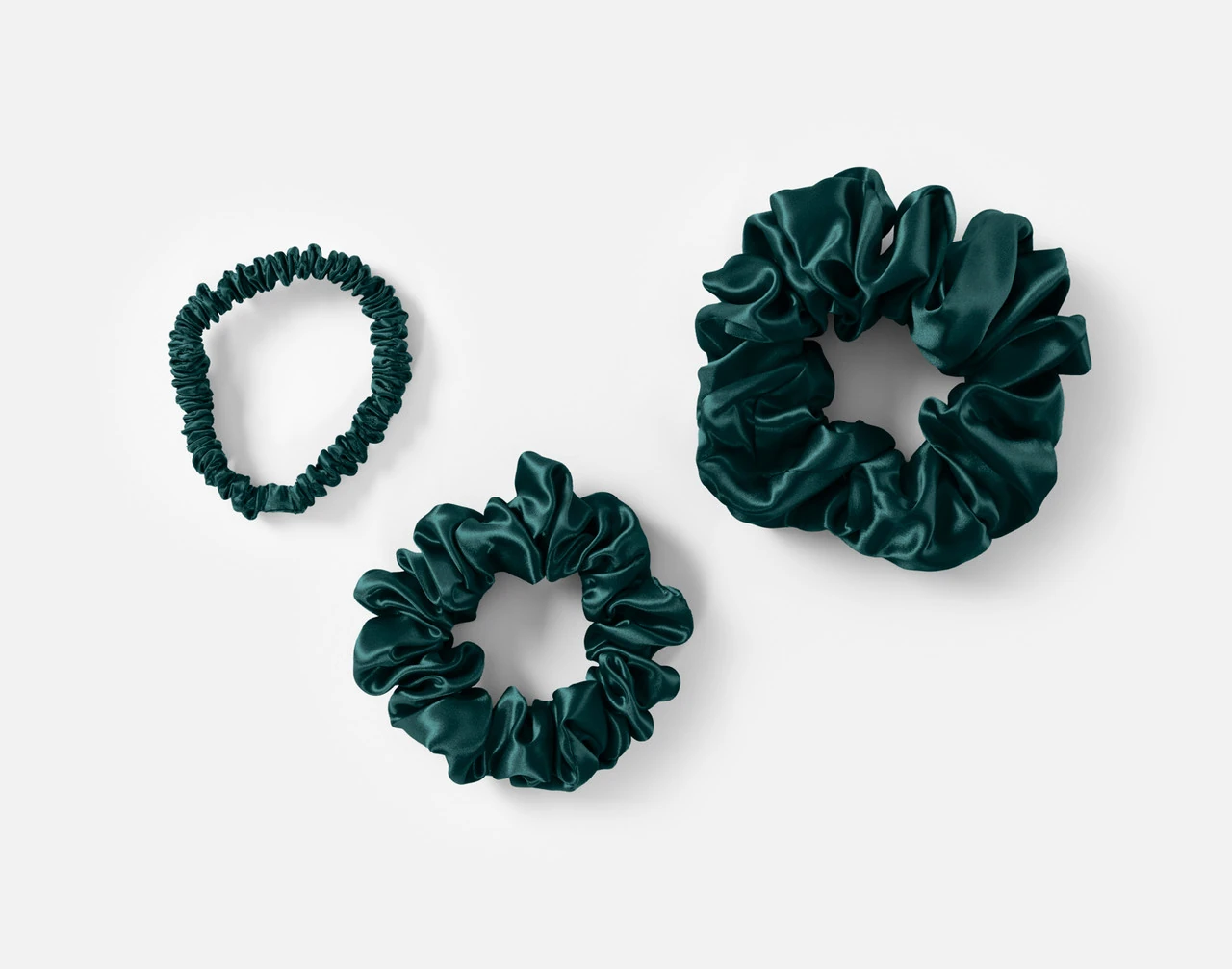 Top view of the small, medium and large scrunchies in our Green Mulberry Silk Scrunchie Set.