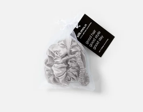 Top view of the mesh bag packaging holding our Silver Mulberry Silk Scrunchie Set.