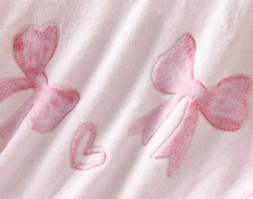 Close-up on the etched designs on our Bows & Hearts Glow In The Dark Throw.