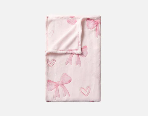 Our Bows & Hearts Glow In The Dark Throw folded into a rectangle.