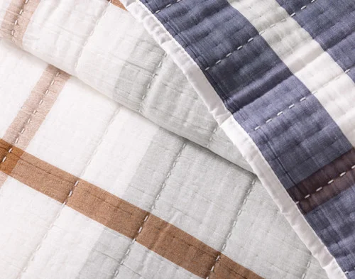 Close up on the folded surface of our Finn Quilt Set.