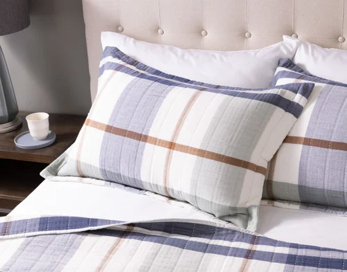 The head of a bed dressed in our Finn Pillow Shams.