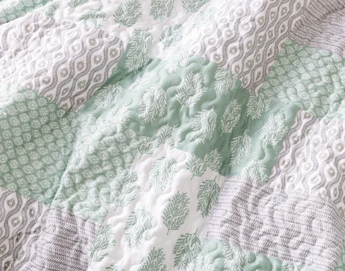 Close-up of the patchwork surface on our Nora Coverlet Set.