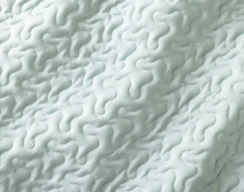 Close-up of the solid reverse on our Nora Coverlet Set.