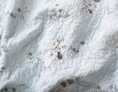 Close-up of the coordinating reverse on our Adeline Cotton Quilt Set.