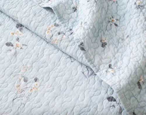 Close-up of the surface and reverse of our Adeline Cotton Quilt Set.