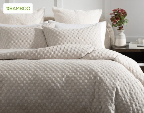Front, off-centre view of our Cavendish Duvet Cover Set dressing a queen bed in a simple bedroom.