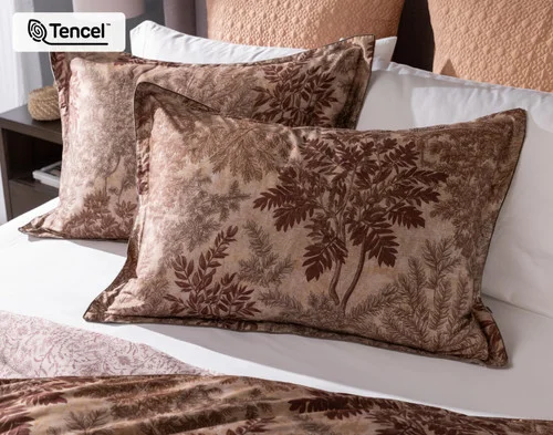 Our Henna Leaf Pillow Shams dressing the head of a bed.