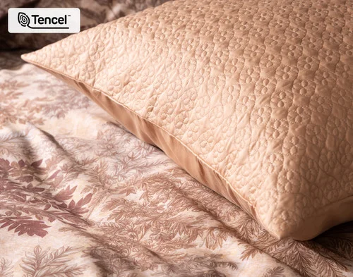 Close up on the corner of our Henna Leaf Euro Sham atop our Henna Leaf Duvet Cover.