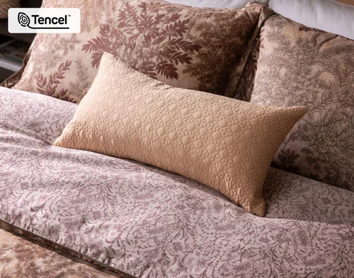 Our Henna Leaf Boudoir Pillow Cover dressing the head of a bed with our Henna Leaf collection.