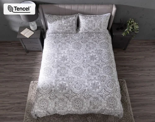 Top-down view of our Romano Duvet Cover dressing a bed with matching pillow shams.