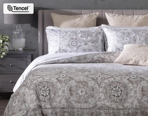 Front, off-centre view of our Romano Duvet Cover dressing a bed with matching pillow shams.