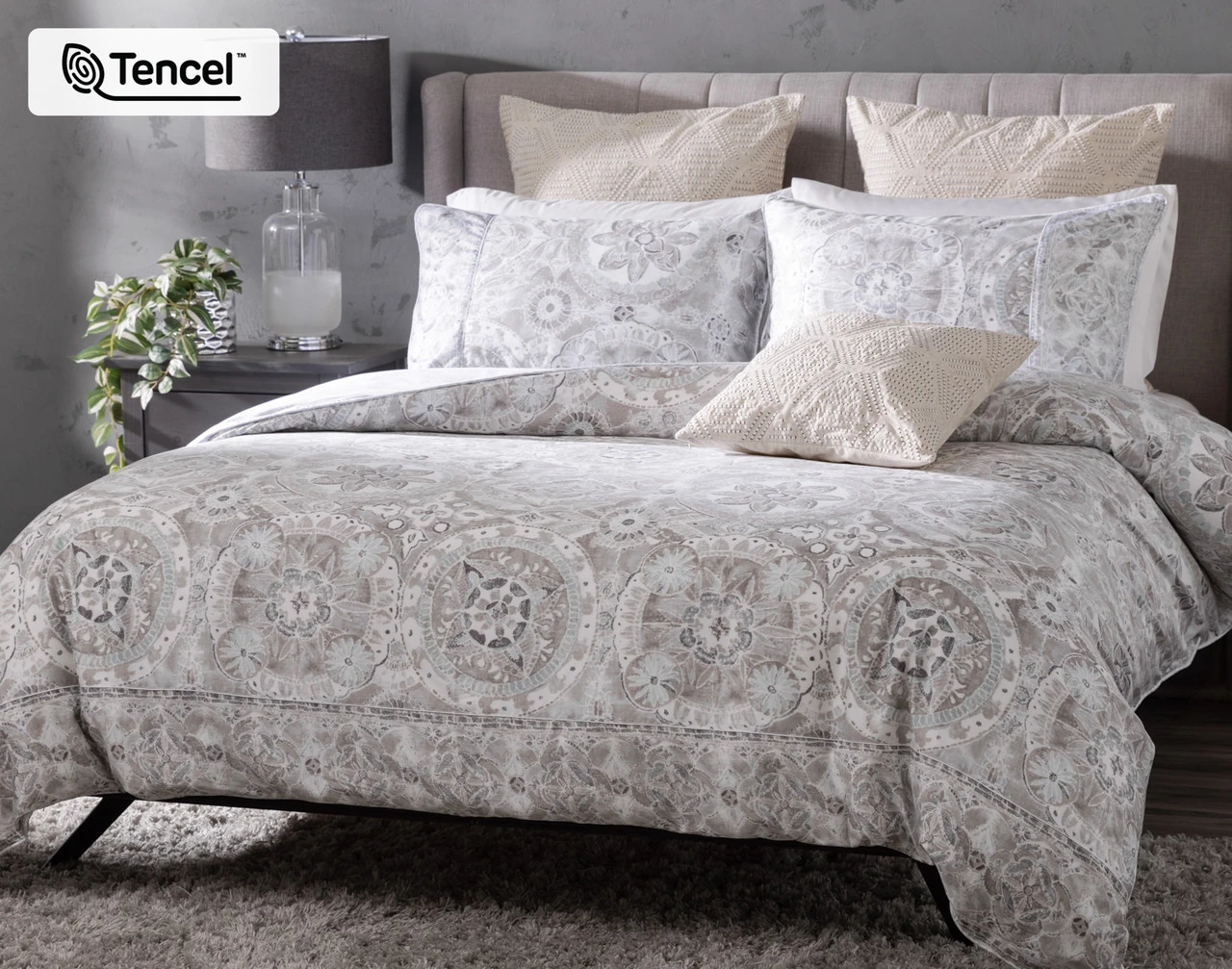 Angled view of our Romano Duvet Cover dressing a bed with matching pillow shams.