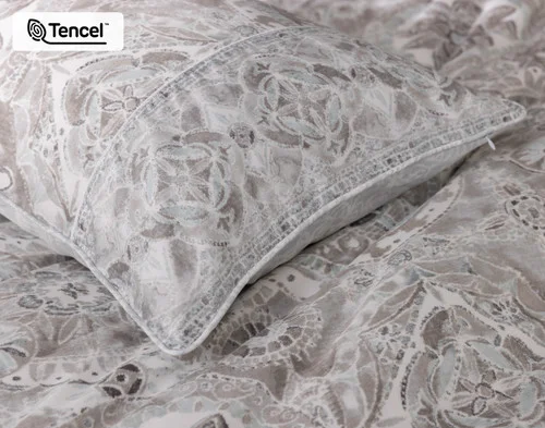 The corner of our Romano Pillow Sham atop our Romano Duvet Cover.