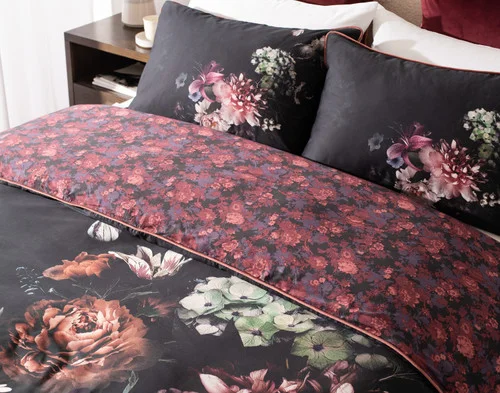 Angled view of our Valentina Duvet Cover dressing the head of a queen bed.