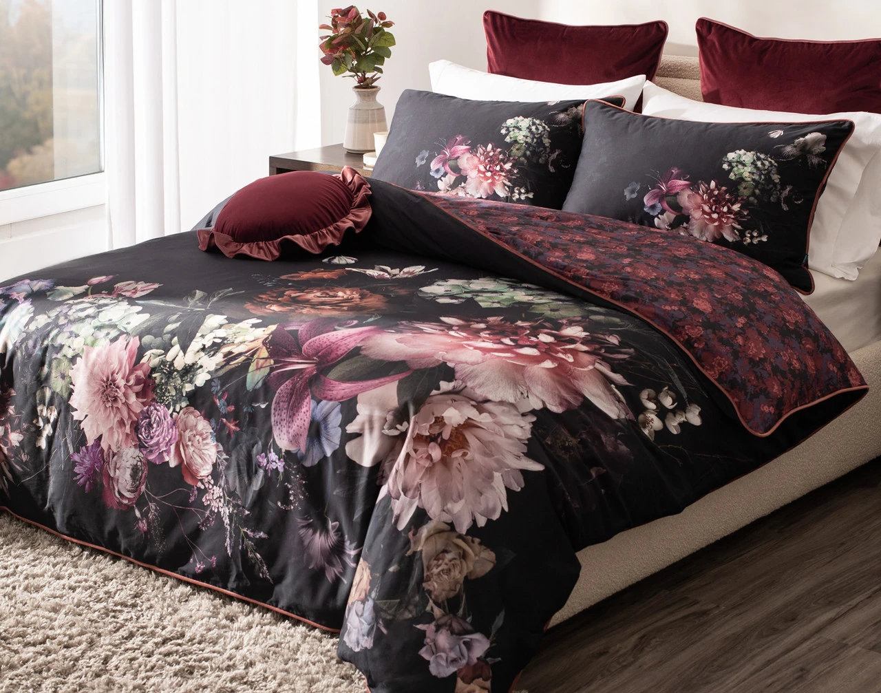 Angled view of our Valentina Duvet Cover dressing a queen bed in a simple bedroom.