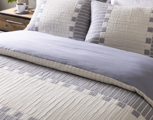 Angled view of our Rocco collection dressing the head of a bed.