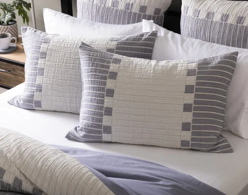 Our Rocco Pillow Shams decorating the head of a bed.