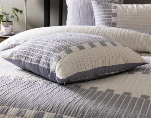 Our Rocco Euro Sham resting on a bed with our Rocco collection.