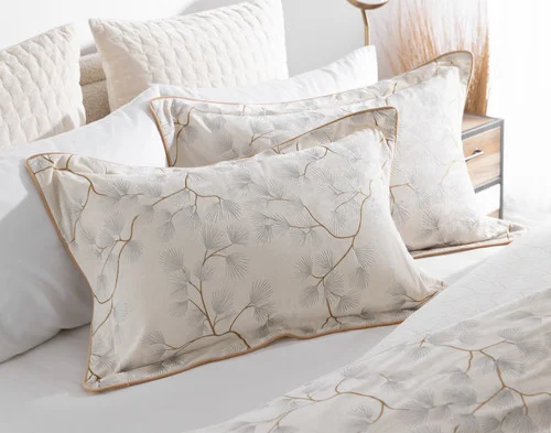 Our Silverbough Pillow Shams resting at the head of a bed.