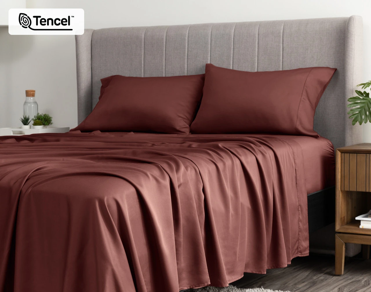 Angled view of a queen bed dressed in our BeechBliss TENCEL™ Modal Sheet Set in Mahogany.